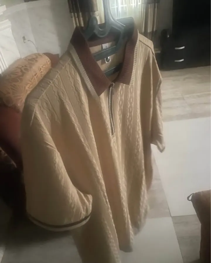 Original marketplace photo of a cream cable-knit polo shirt