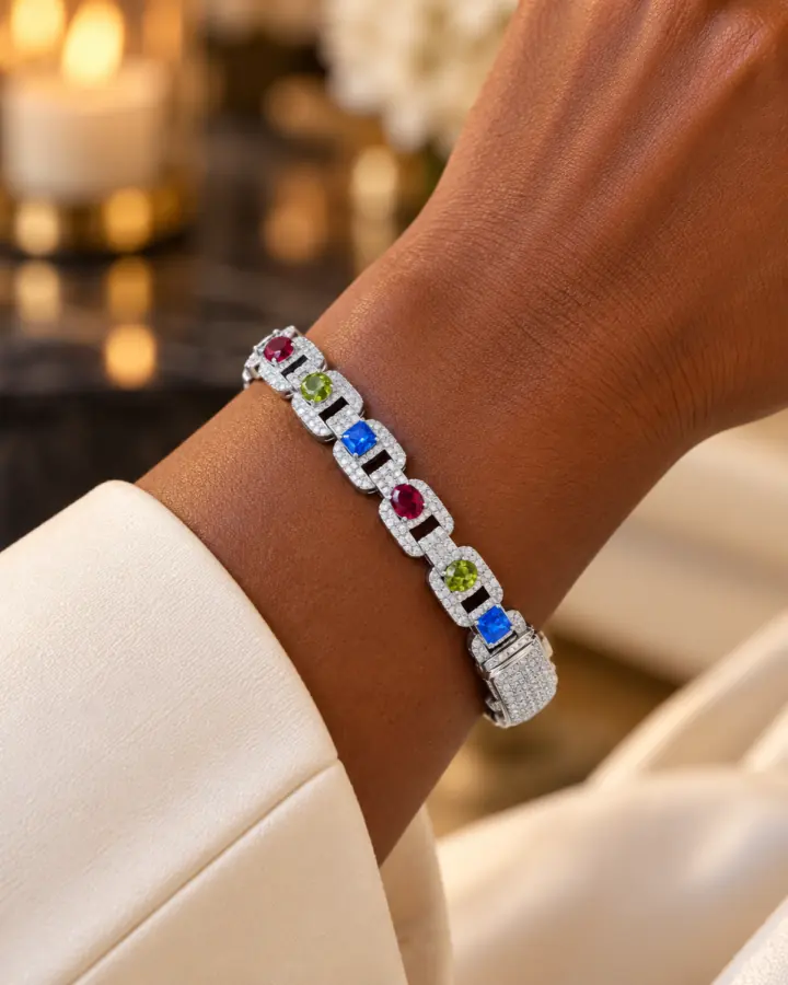 Silver bracelet with colourful gemstones worn on a wrist