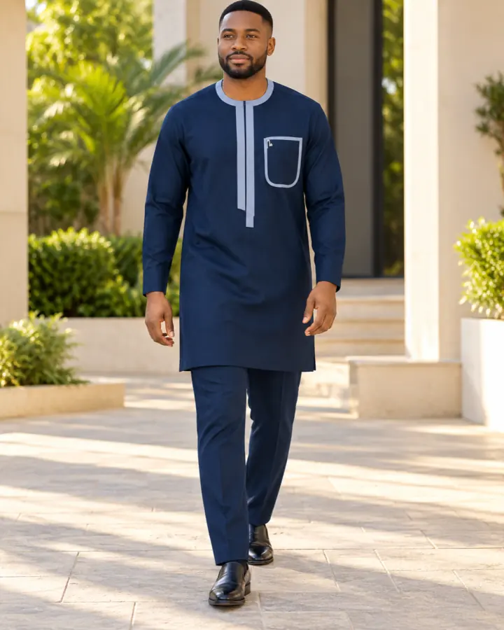 Model wearing the navy kaftan with pale blue trim outdoors