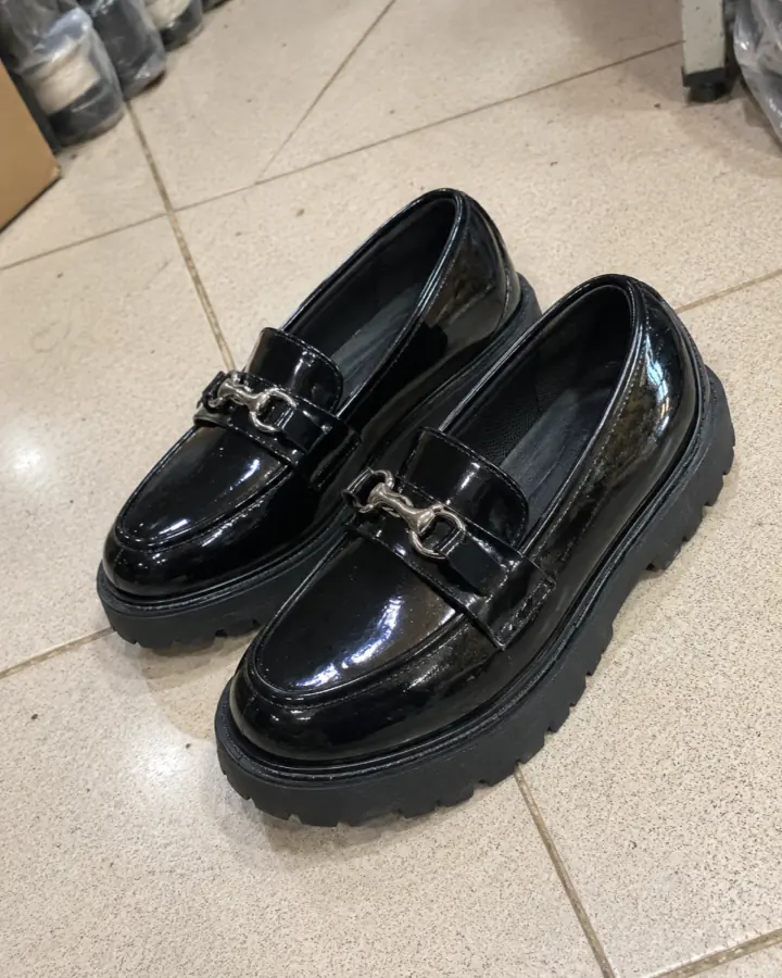 Original marketplace photo of black patent loafers