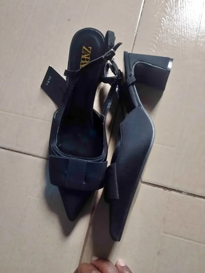 Original marketplace photo of black bow slingback heels