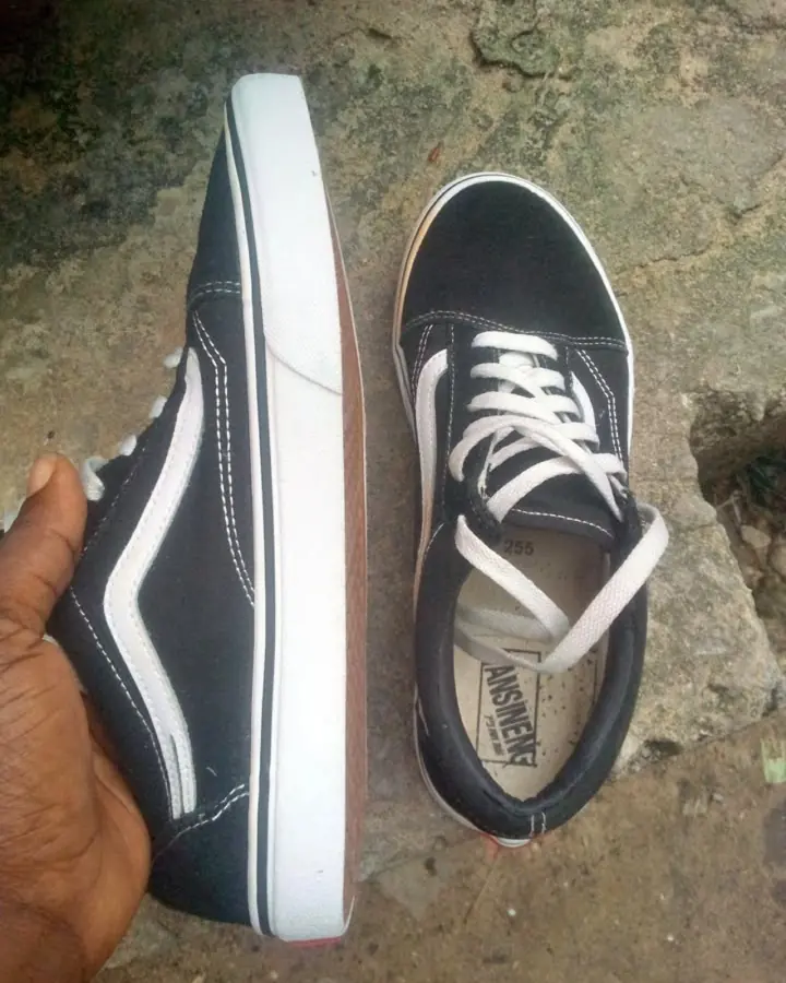 Original marketplace photo of black and white sneakers